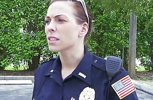Female cops captivate over black suspect with an increment of suck his cock